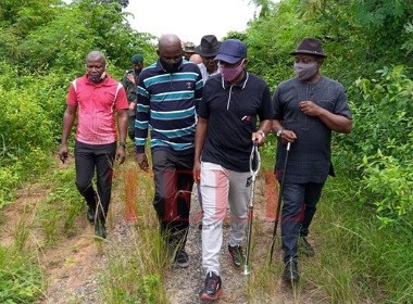 Okparaji, Victor and others touring overgrown streets in Ekporo Photo