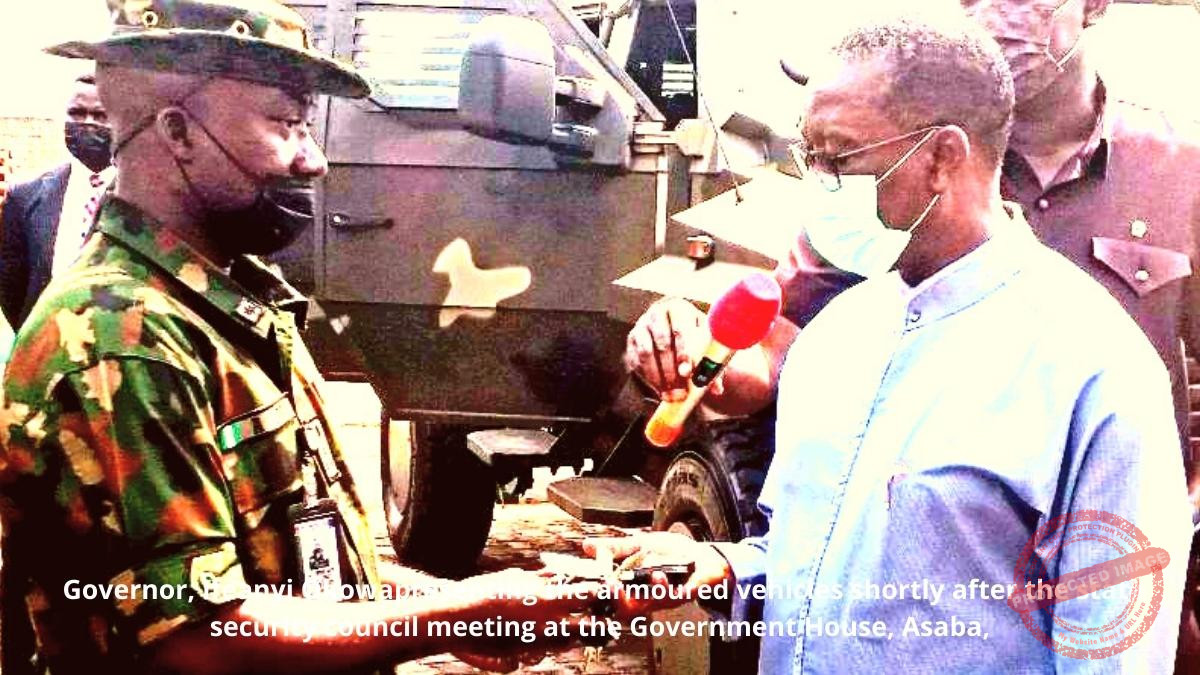 Governor, Ifeanyi Okowapresenting the armoured vehicles shortly after the state security council meeting at the Government House, Asaba,